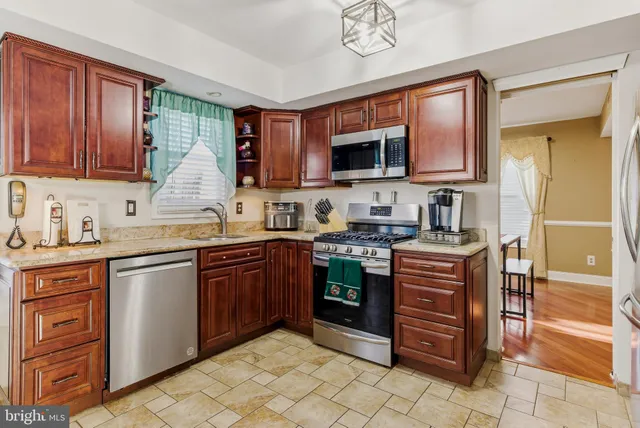 a outdoor dining space with furniture and a kitchen view
