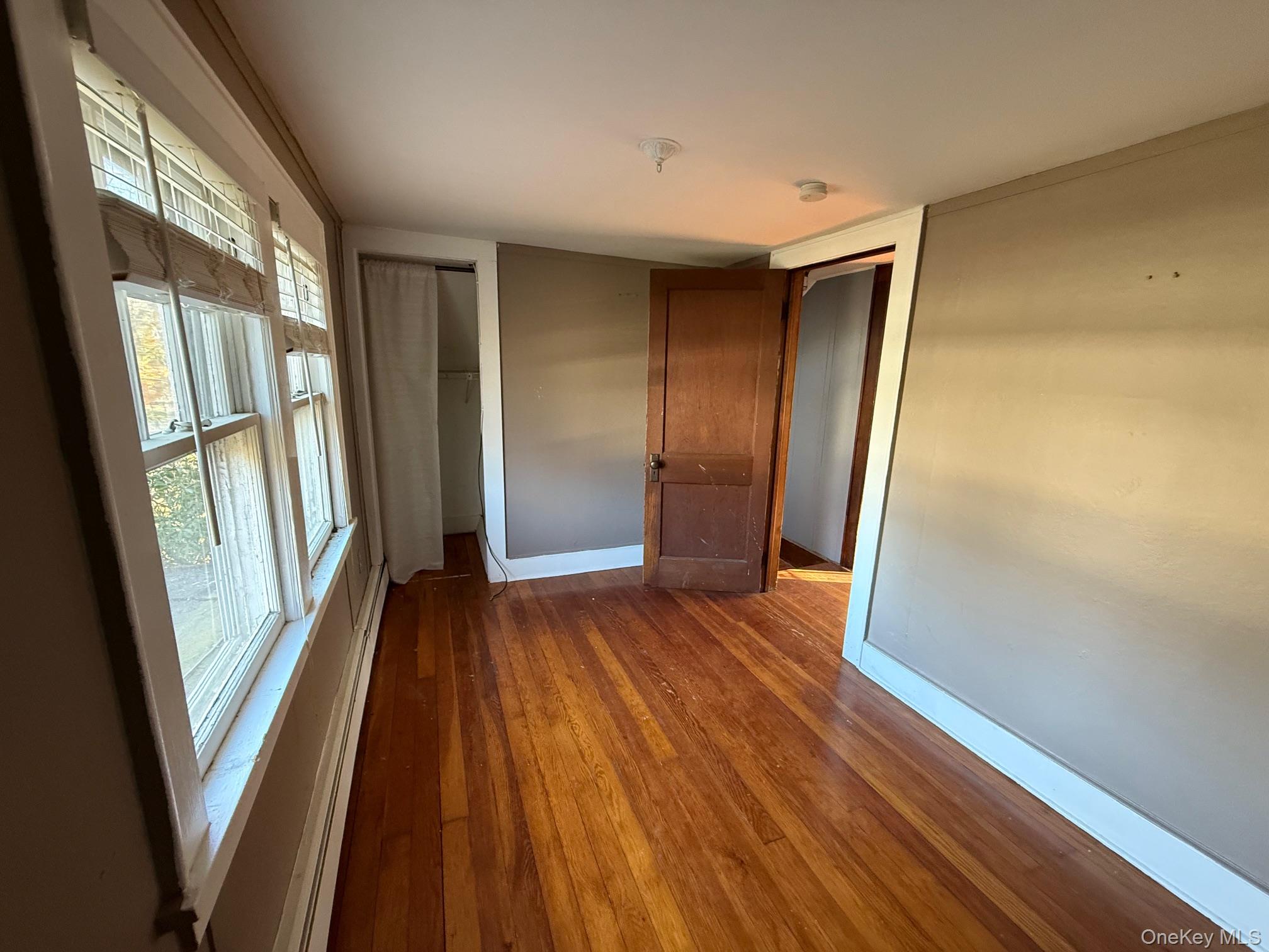 182 Maple Hill Road Huntington, NY 11743 - Photo 16 of 24 a view of wooden floor in an empty room