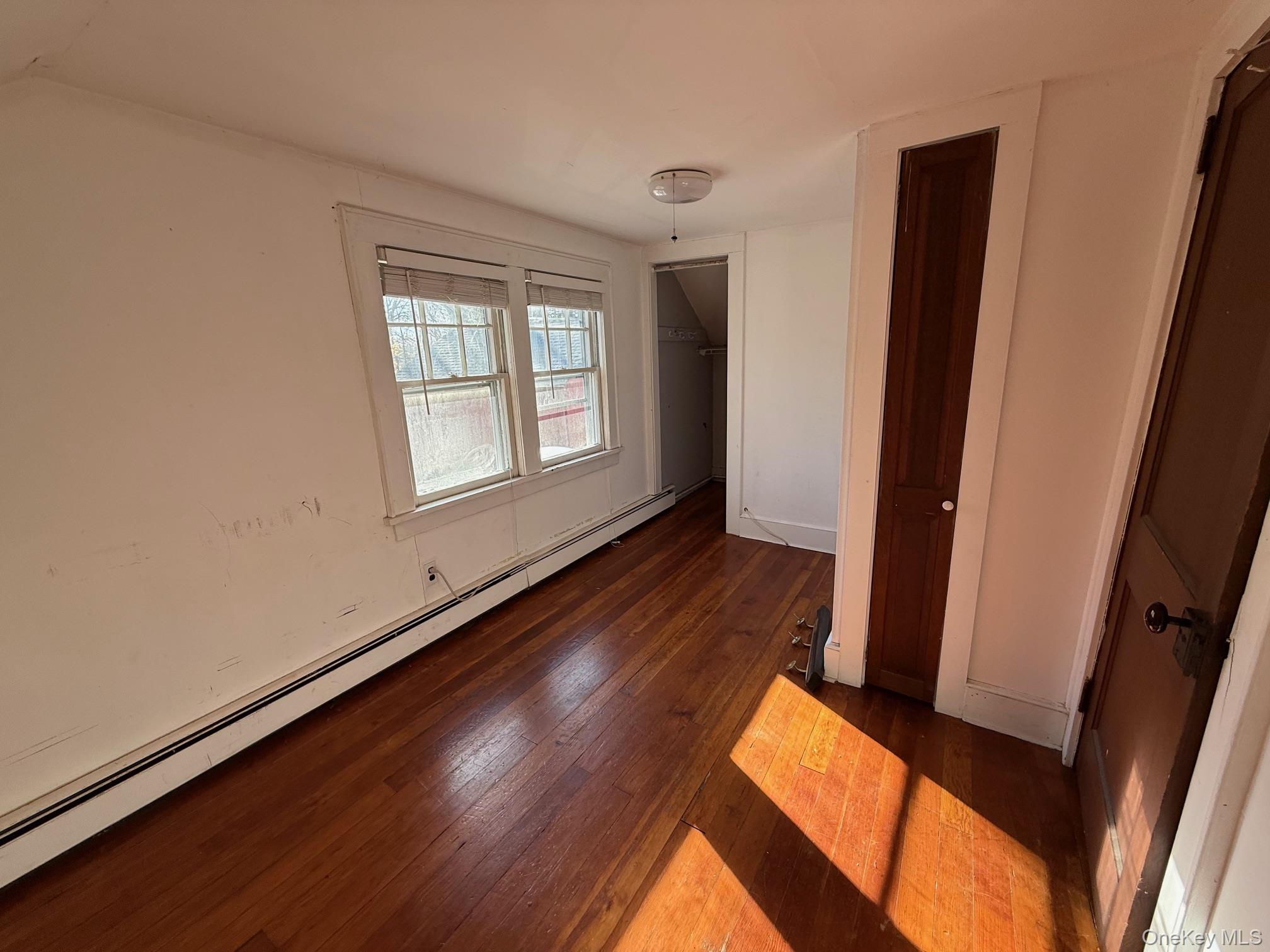 182 Maple Hill Road Huntington, NY 11743 - Photo 20 of 28 a view of an empty room and wooden floor