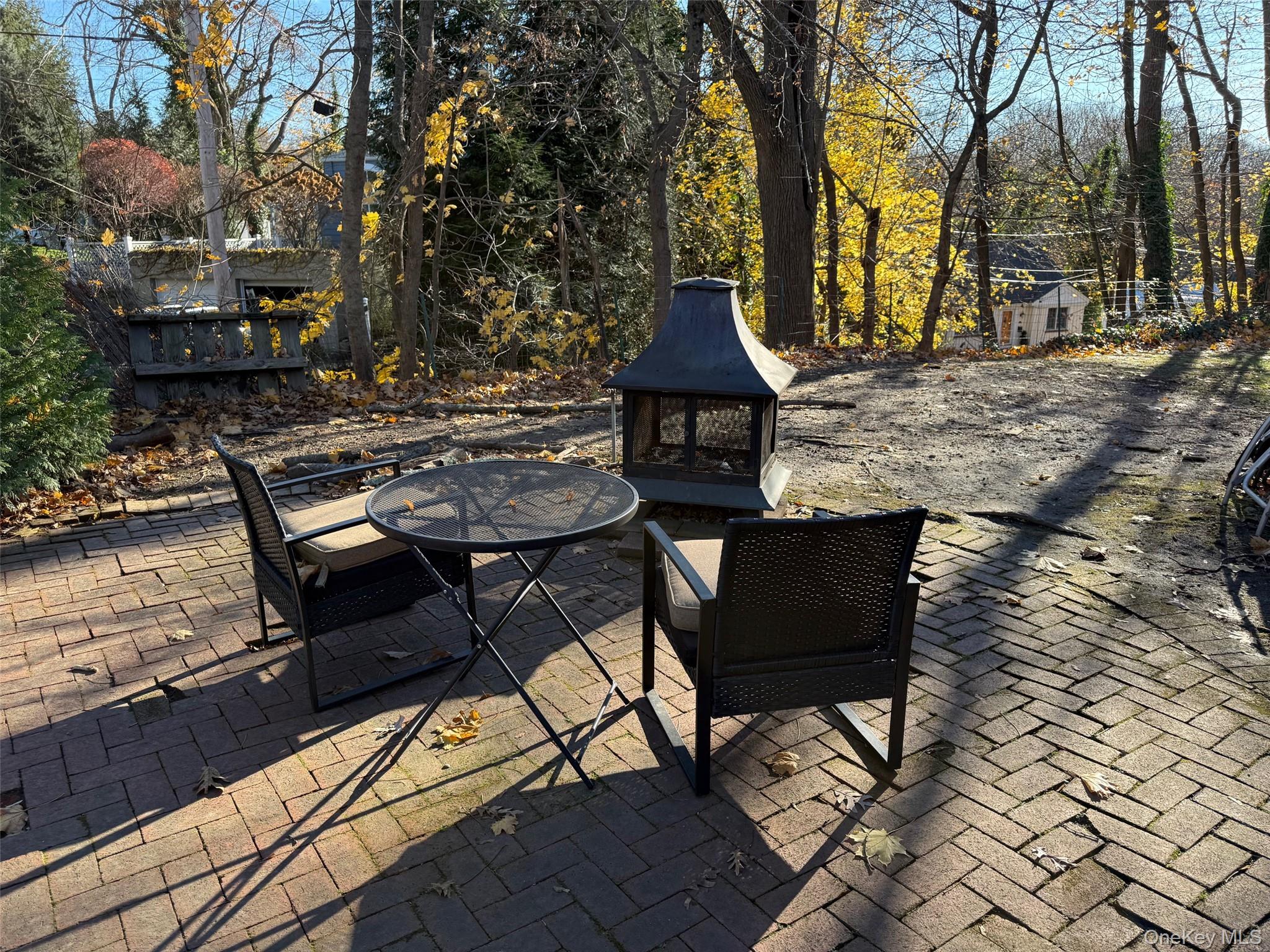 182 Maple Hill Road Huntington, NY 11743 - Photo 23 of 24 a view of a chairs and table on the patio