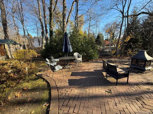 a view of a two chairs in the patio