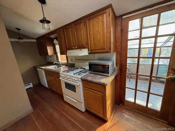a kitchen with stainless steel appliances granite countertop a stove and a refrigerator