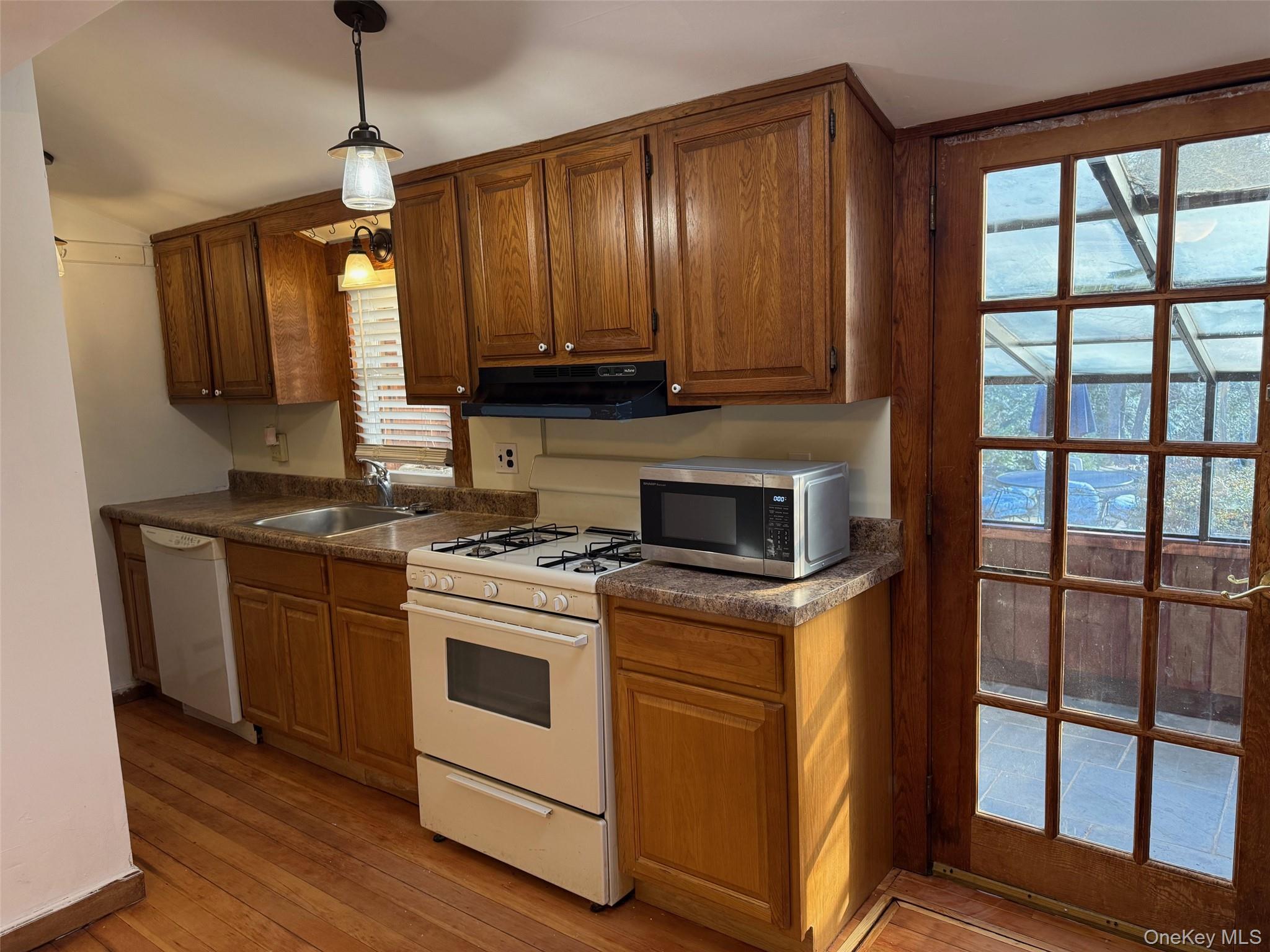 182 Maple Hill Road Huntington, NY 11743 - Photo 8 of 28 a kitchen with a stove a sink and a refrigerator