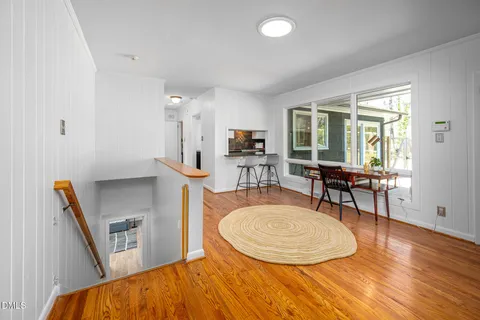 a view of a livingroom with furniture window and wooden floor