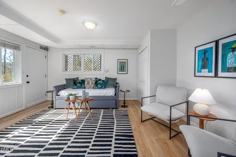 a living room with furniture and a rug