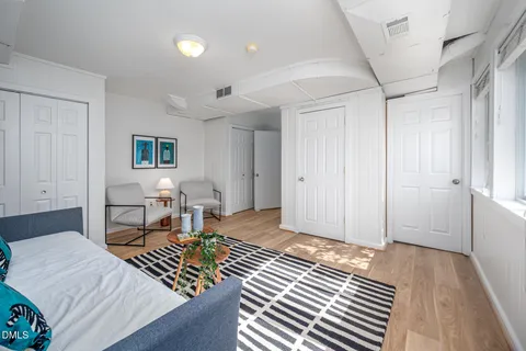 a bedroom with a bed and furniture
