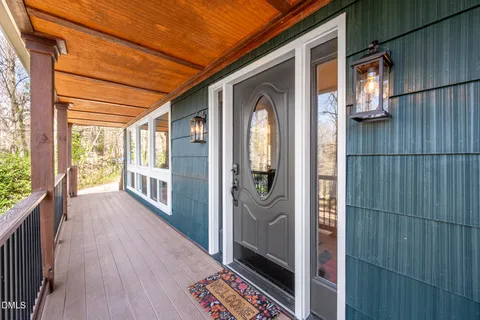a view of balcony with wooden floor