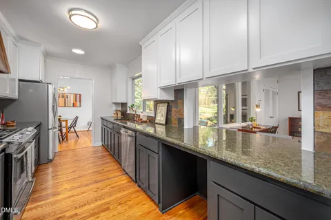 a large kitchen with granite countertop lots of counter top space