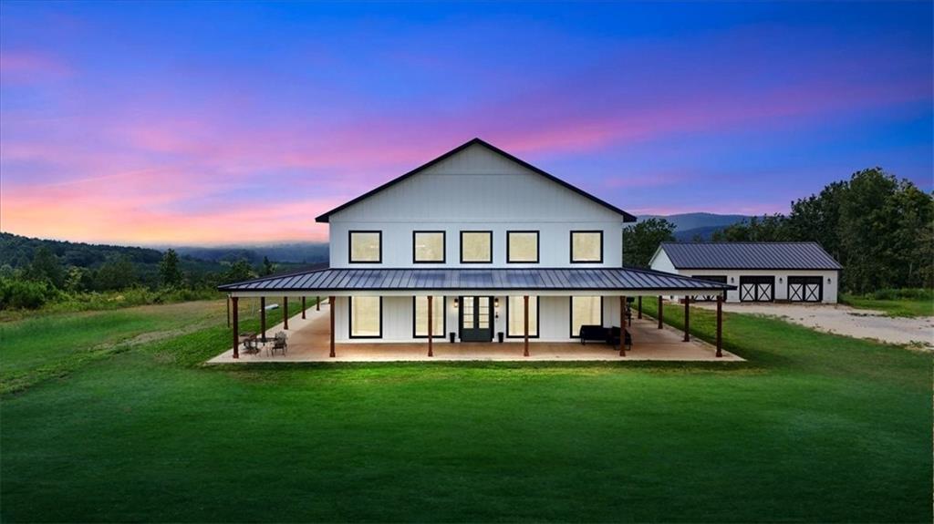 a view of a house with a yard