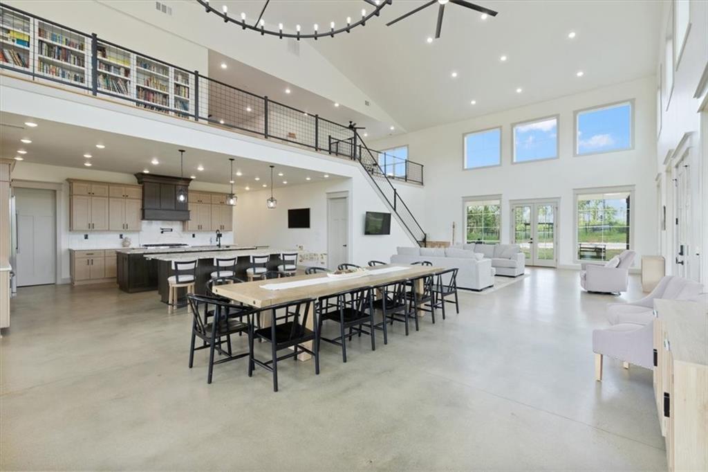 664 Wiggins Road Lyerly, GA 30730 - Photo 14 of 69 a dining hall with stainless steel appliances a dining table and chairs