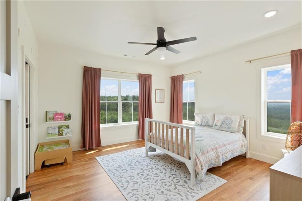 664 Wiggins Road Lyerly, GA 30730 - Photo 26 of 69 a bedroom with a bed and wooden floor