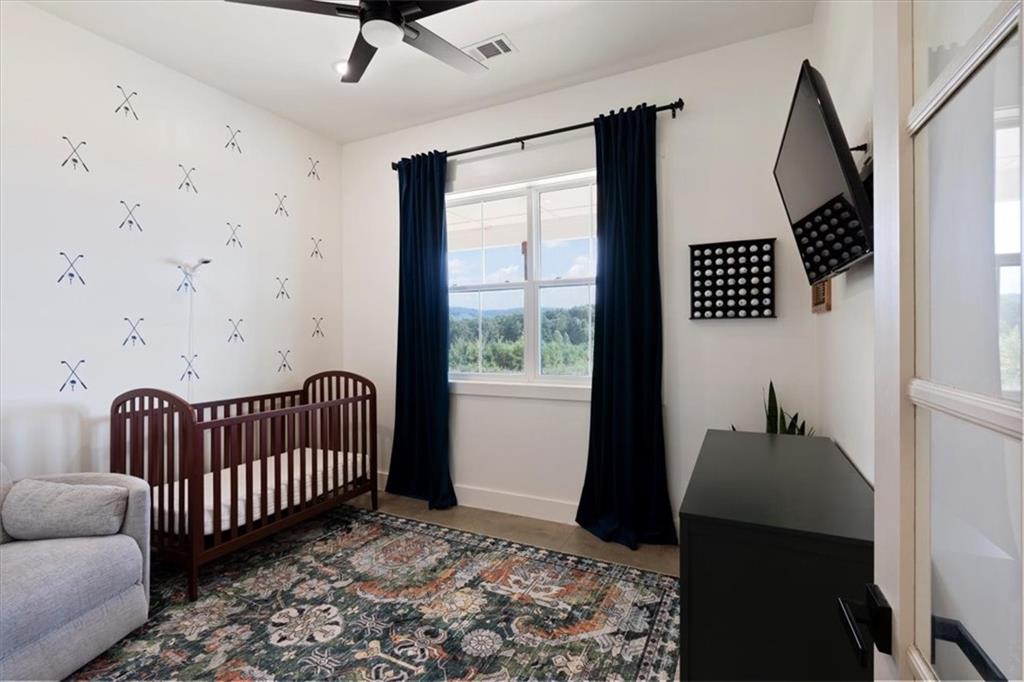 664 Wiggins Road Lyerly, GA 30730 - Photo 35 of 69 a bedroom with furniture and a window