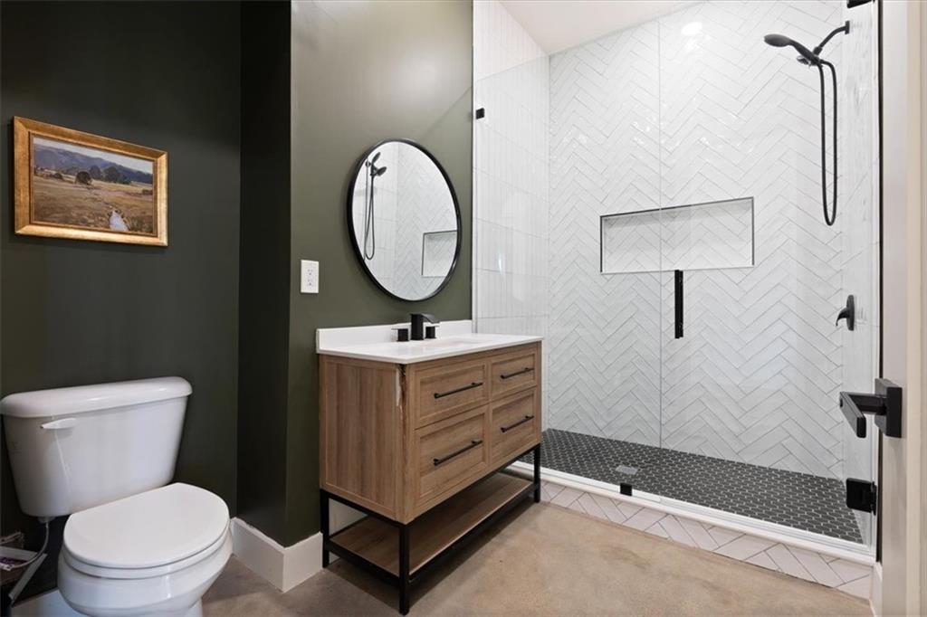 664 Wiggins Road Lyerly, GA 30730 - Photo 36 of 69 a bathroom with a toilet sink and mirror