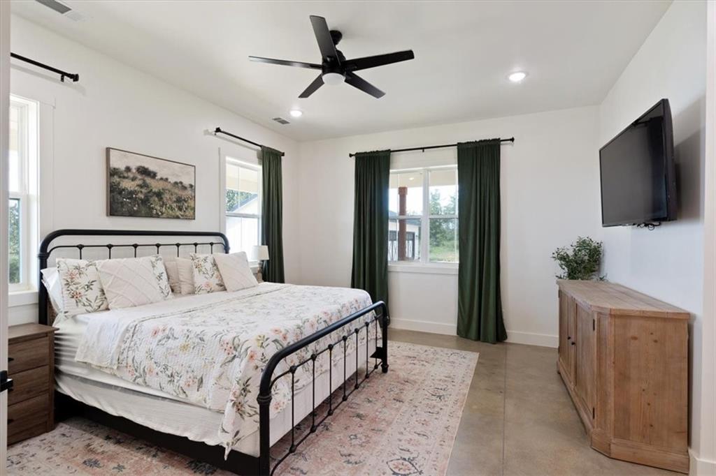 664 Wiggins Road Lyerly, GA 30730 - Photo 37 of 69 a bedroom with a large bed and a flat screen tv