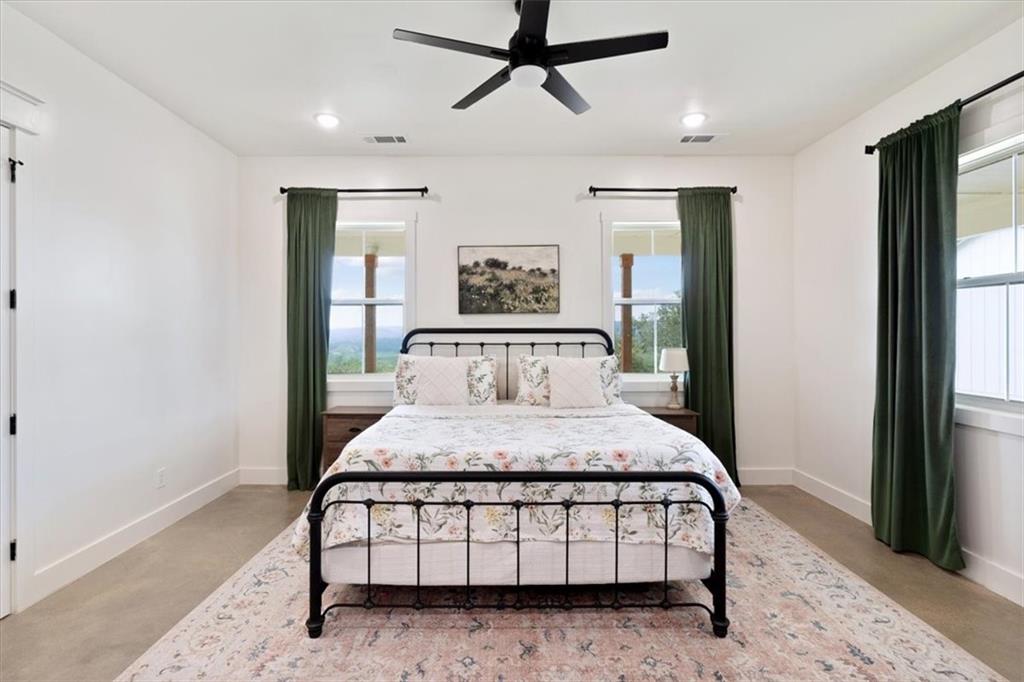 664 Wiggins Road Lyerly, GA 30730 - Photo 38 of 69 a bedroom with a bed mirror and window