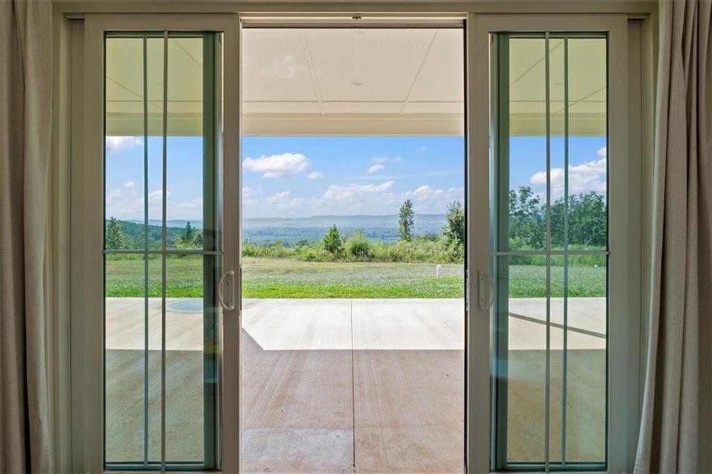 664 Wiggins Road Lyerly, GA 30730 - Photo 44 of 69 a view of a glass door with a from chair