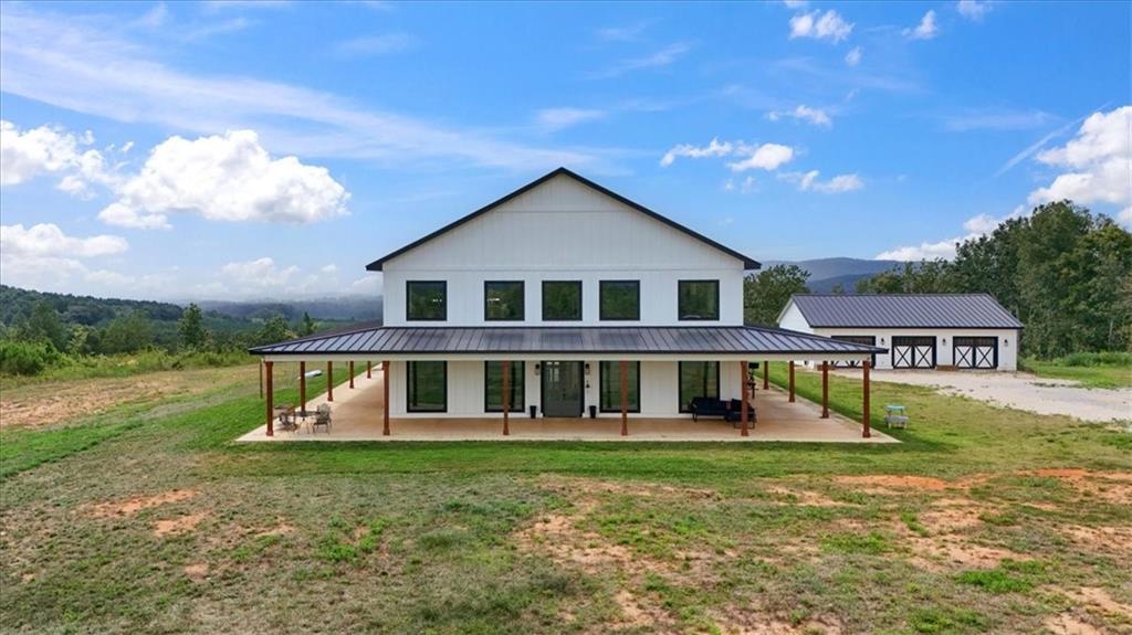 664 Wiggins Road Lyerly, GA 30730 - Photo 49 of 69 front view of a house with a yard
