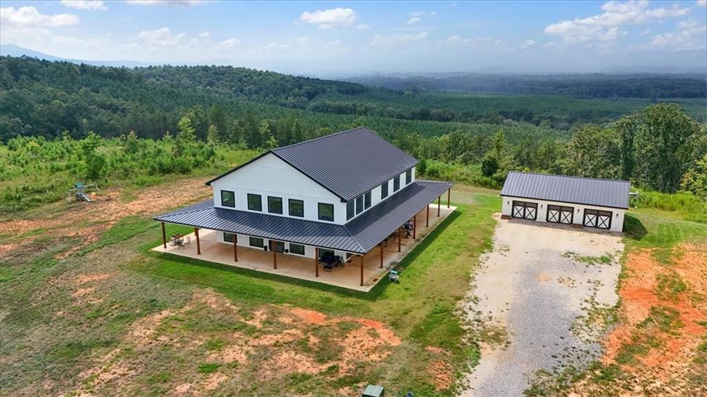 664 Wiggins Road Lyerly, GA 30730 - Photo 55 of 69 an aerial view of a house with a big yard