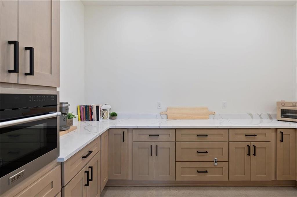 664 Wiggins Road Lyerly, GA 30730 - Photo 7 of 69 a kitchen with granite countertop white cabinets and white appliances