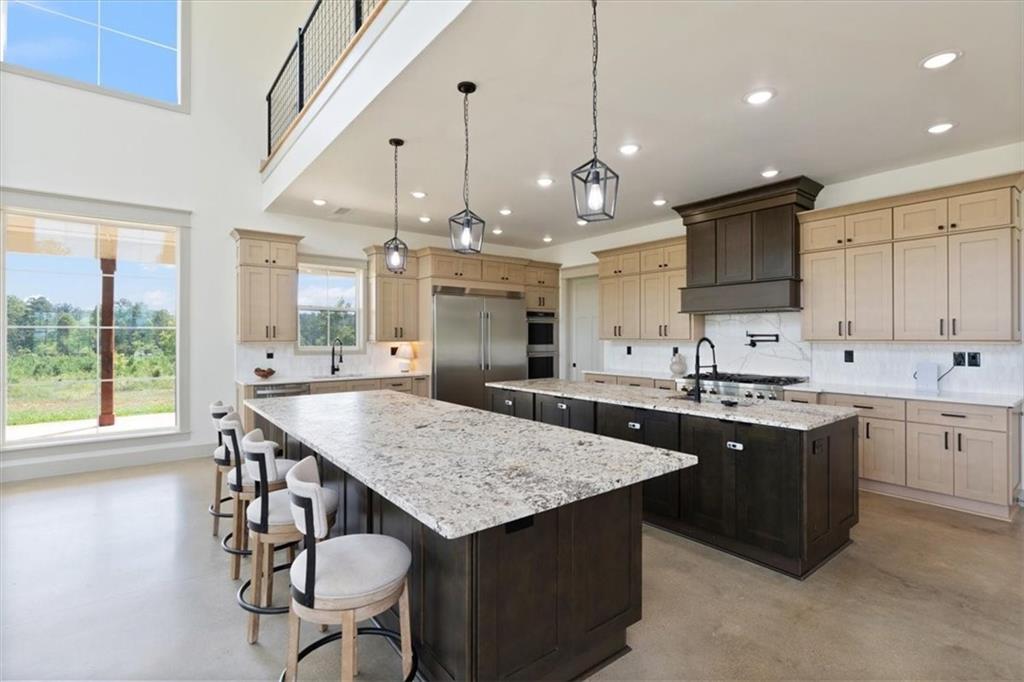 664 Wiggins Road Lyerly, GA 30730 - Photo 9 of 69 a kitchen with stainless steel appliances granite countertop a kitchen island a stove and a sink