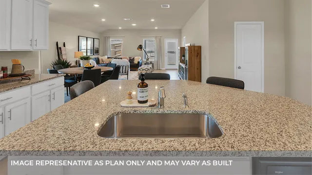 a kitchen with stainless steel appliances granite countertop a sink a refrigerator and a granite counter tops