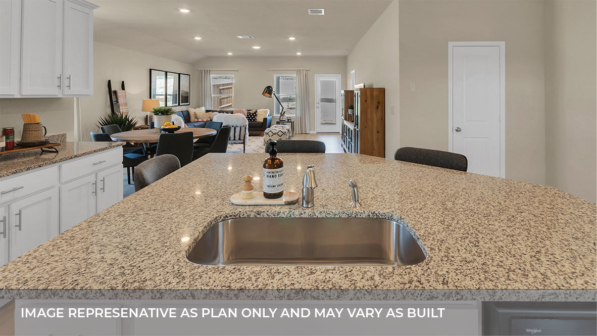 1920 Gold Dust Trail Leander, TX 78641 - Photo 13 of 26 a kitchen with stainless steel appliances granite countertop a sink a refrigerator and a granite counter tops