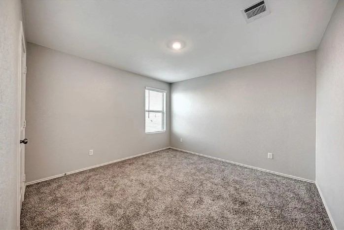 817 Circle Way, Unit 7I Jarrell, TX 76537 - Photo 24 of 33 Unfurnished room featuring carpet floors and baseboards