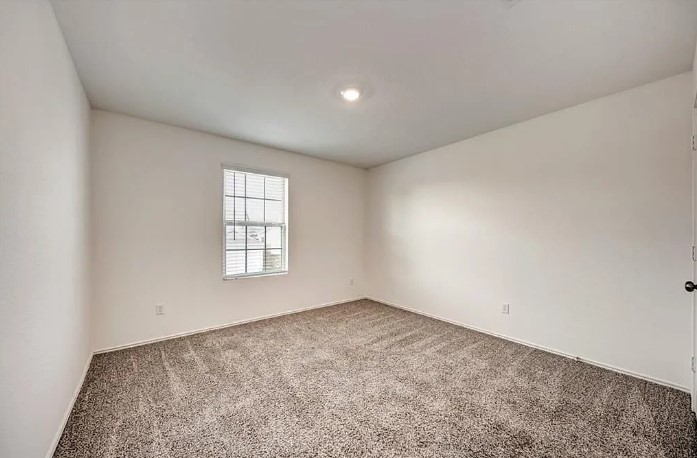 817 Circle Way, Unit 7I Jarrell, TX 76537 - Photo 29 of 33 Carpeted empty room with baseboards