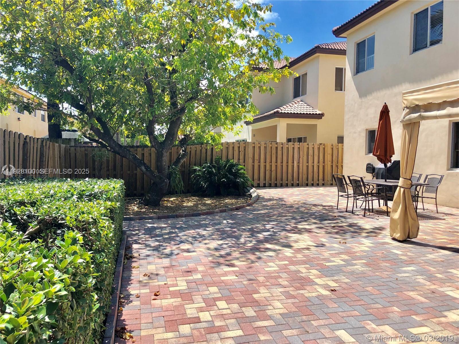 867 Southwest 155th Court Miami, FL 33194 - Photo 15 of 31 a front view of a house with garden