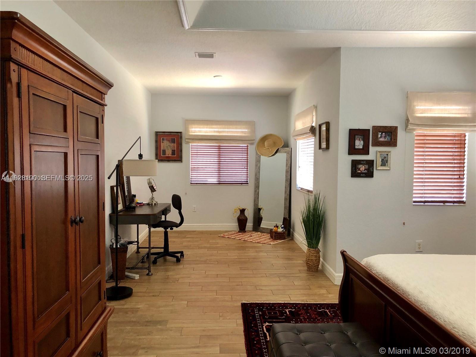 867 Southwest 155th Court Miami, FL 33194 - Photo 23 of 31 a room with pool table and windows