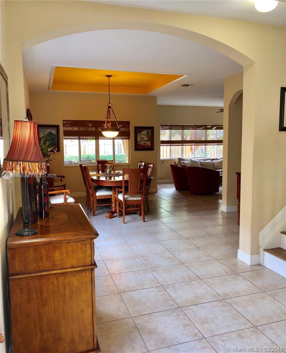 867 Southwest 155th Court Miami, FL 33194 - Photo 10 of 31 a room with lots of furniture and chandelier