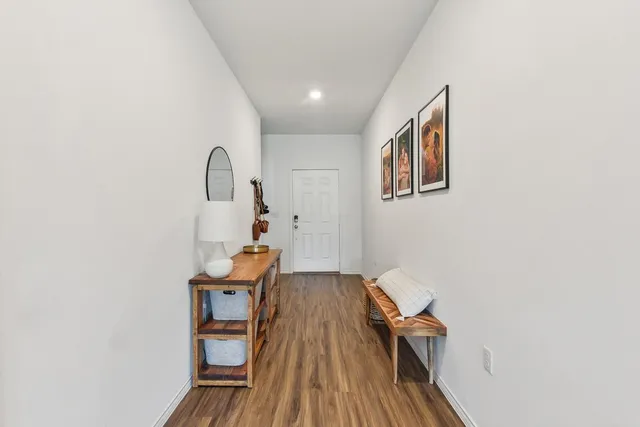 a view of a hallway with chairs