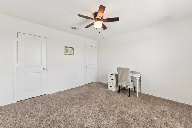a view of work space with lounge chair