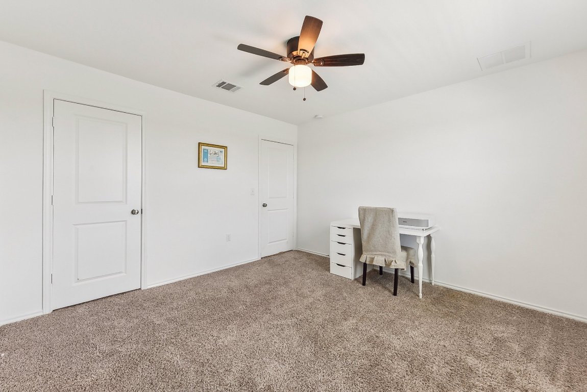 5908 Eden Drive Austin, TX 78747 - Photo 17 of 31 a view of work space with lounge chair