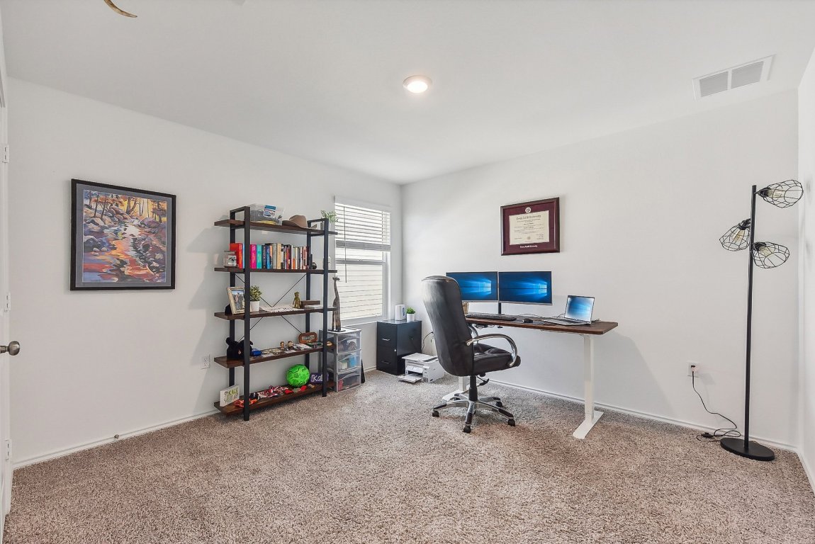 5908 Eden Drive Austin, TX 78747 - Photo 26 of 31 a view of a workspace with furniture
