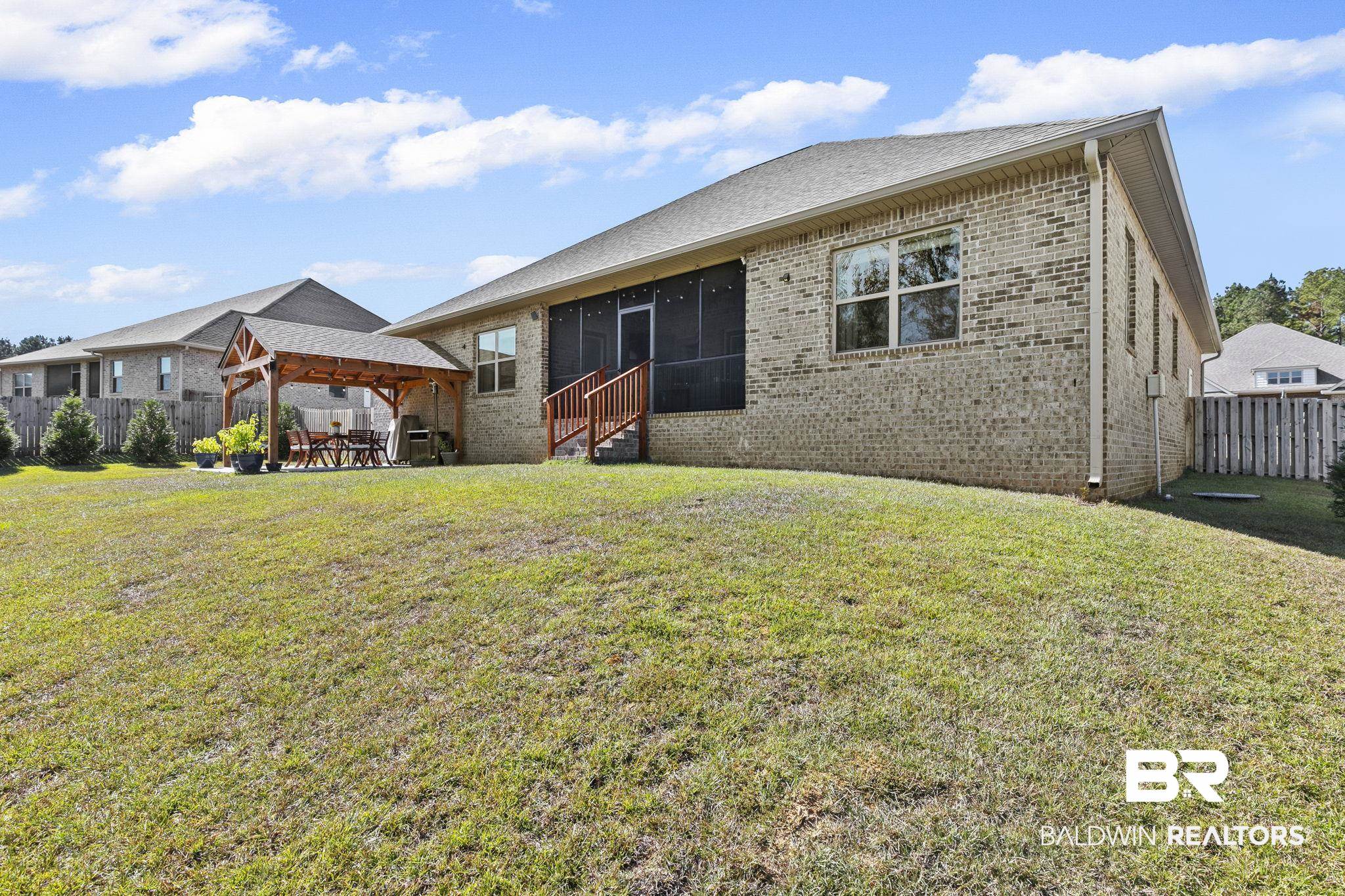 31500 Spoonbill Road Daphne, AL 36527 - Photo 54 of 85 Back of property with a lawn and a sunroom