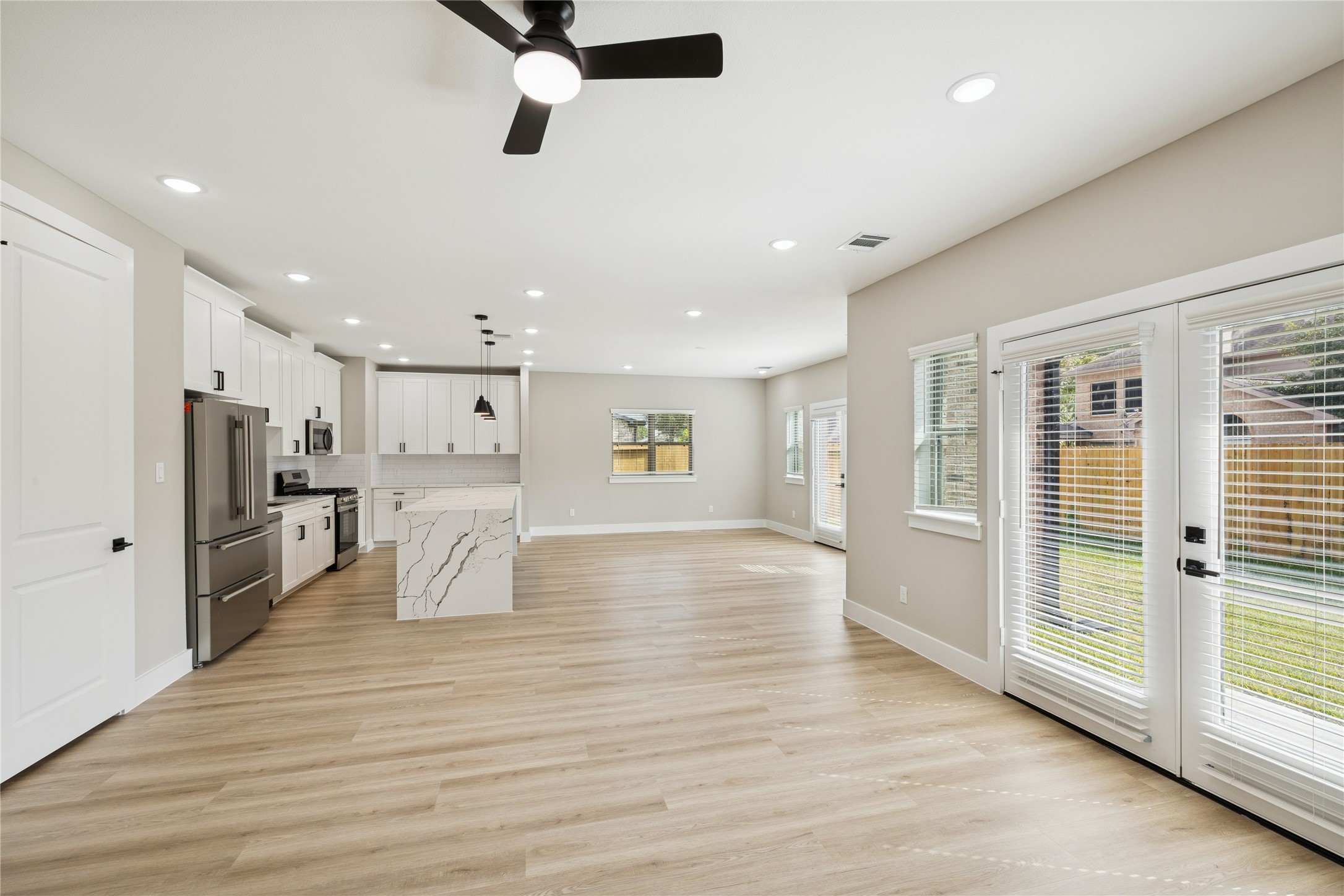 2602 Martinas Ct Spring Spring, TX 77388 - Photo 6 of 24 Spacious and inviting family room with abundant natural light and seamless flow to the kitchen and backyard.