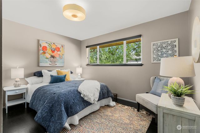 a bed room with a bed and a lamp