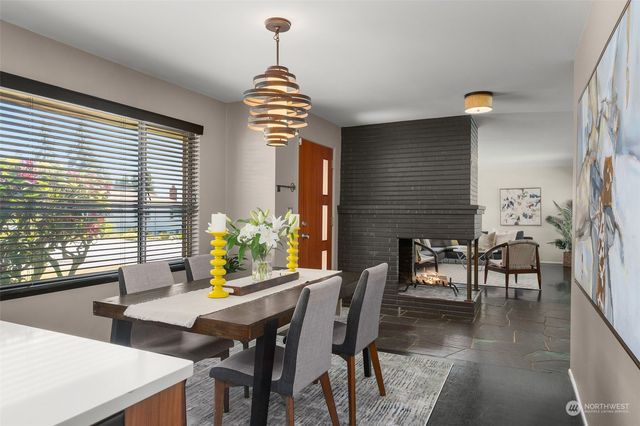 a view of a dining room with furniture and window
