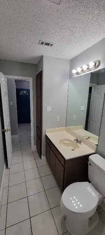 a bathroom with a sink a mirror and a shower