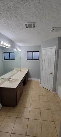 a view of an empty room with a fan