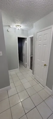 a large kitchen with a stove and a sink