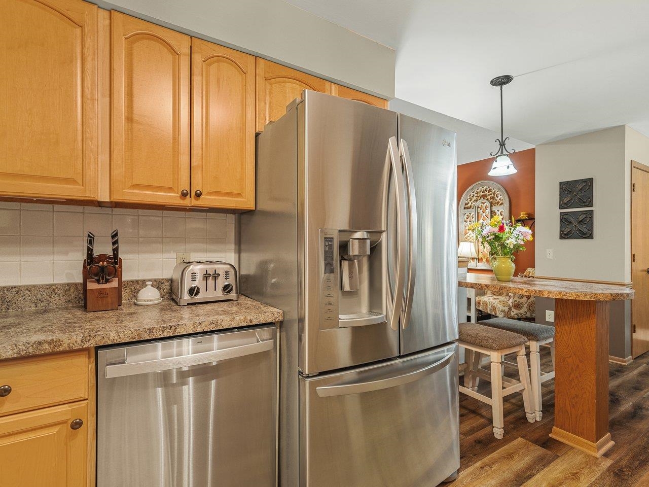 1816 Post Road Beloit, WI 53511 - Photo 16 of 42 a kitchen with stainless steel appliances granite countertop a refrigerator sink and cabinets