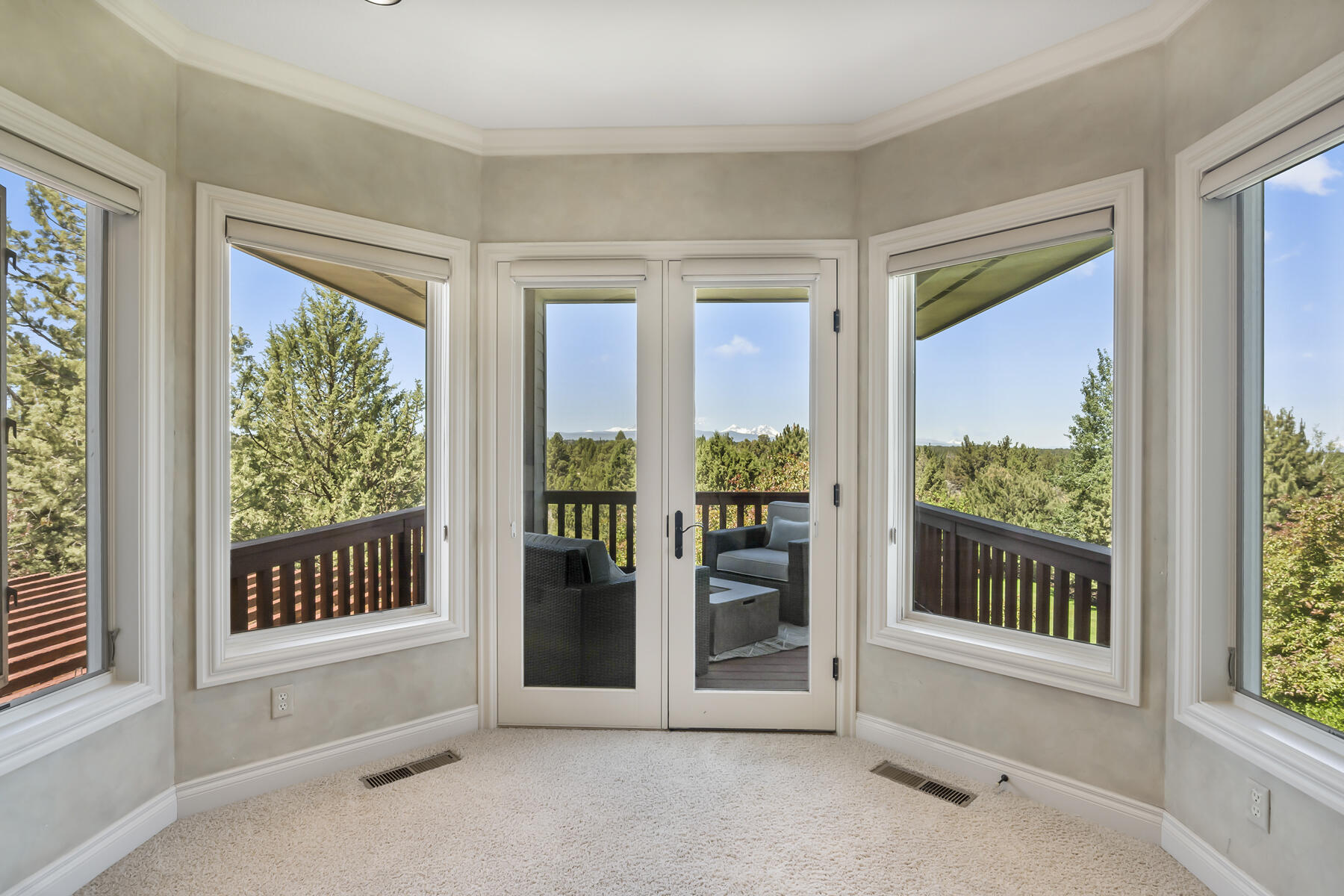 61445 Gosney Road Bend, OR 97702 - Photo 57 of 83 a view of front door and porch with a floor to ceiling window
