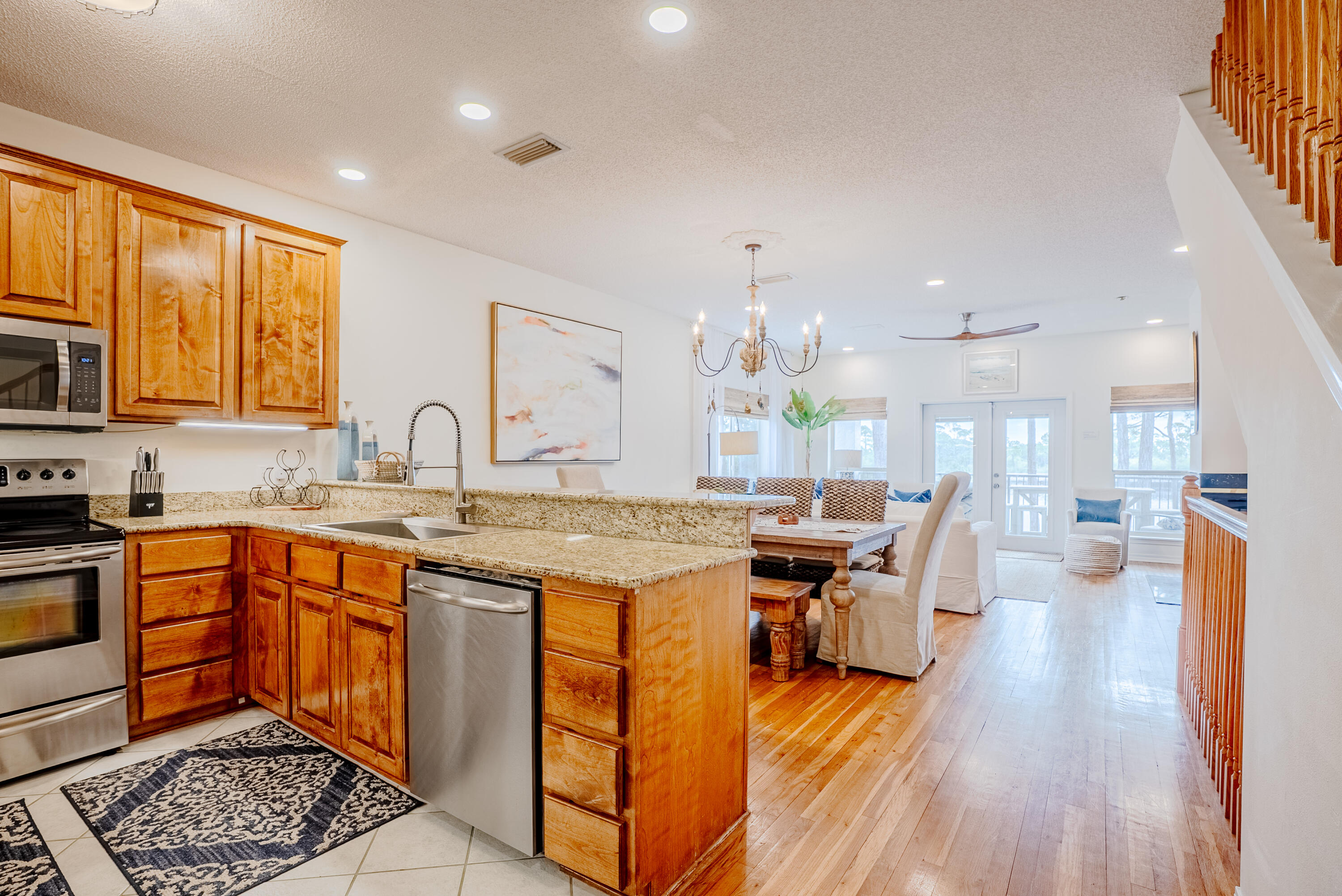 10 Mar-A-Lago Boulevard, Unit 14 Santa Rosa Beach, FL 32459 - Photo 12 of 47 a large kitchen with stainless steel appliances granite countertop a lot of counter space and wooden floors