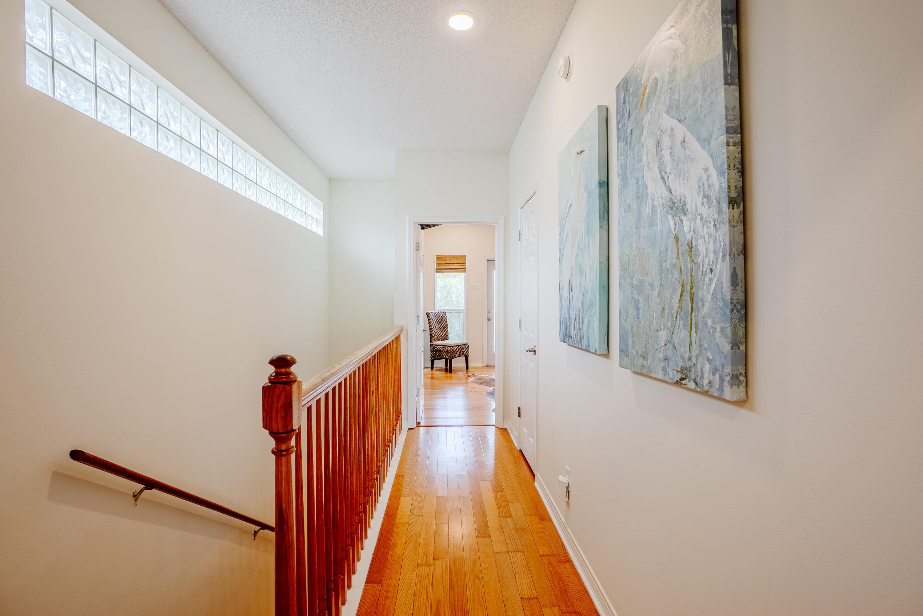 10 Mar-A-Lago Boulevard, Unit 14 Santa Rosa Beach, FL 32459 - Photo 19 of 47 a view of a hallway with wooden floor and staircase
