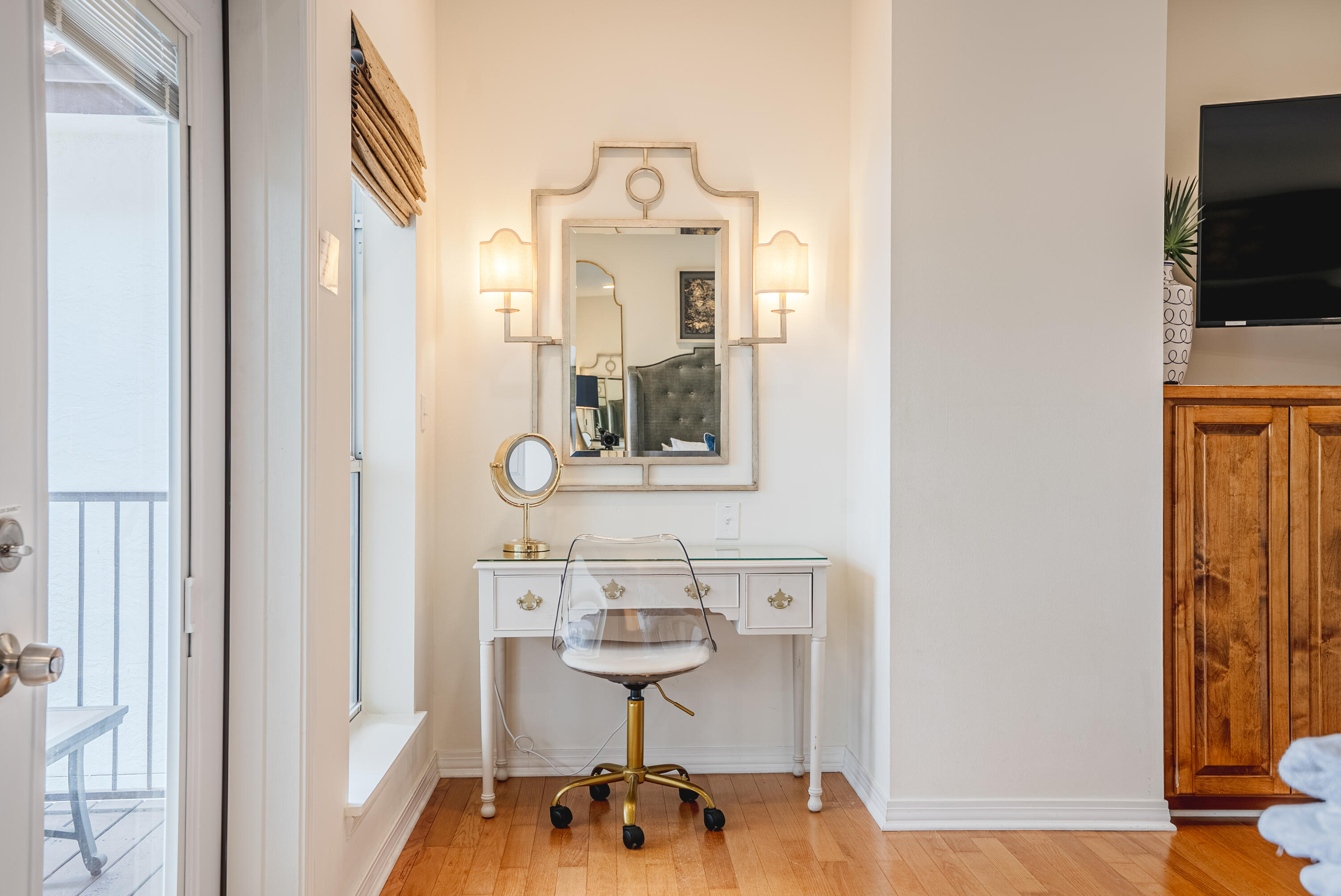 10 Mar-A-Lago Boulevard, Unit 14 Santa Rosa Beach, FL 32459 - Photo 22 of 47 a picture of a room with wooden floor and glass door