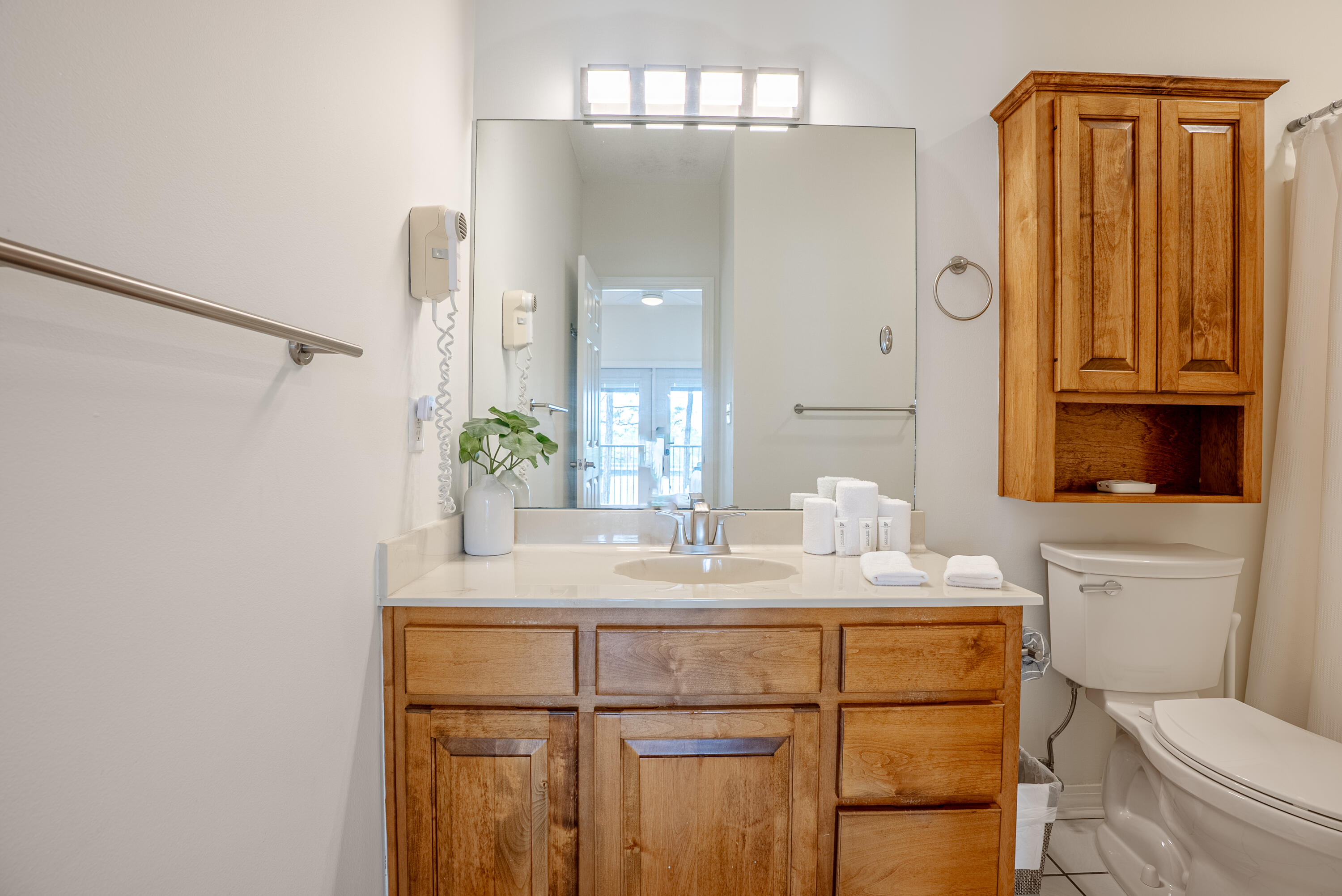 10 Mar-A-Lago Boulevard, Unit 14 Santa Rosa Beach, FL 32459 - Photo 23 of 47 a bathroom with a granite countertop sink mirror vanity and toilet