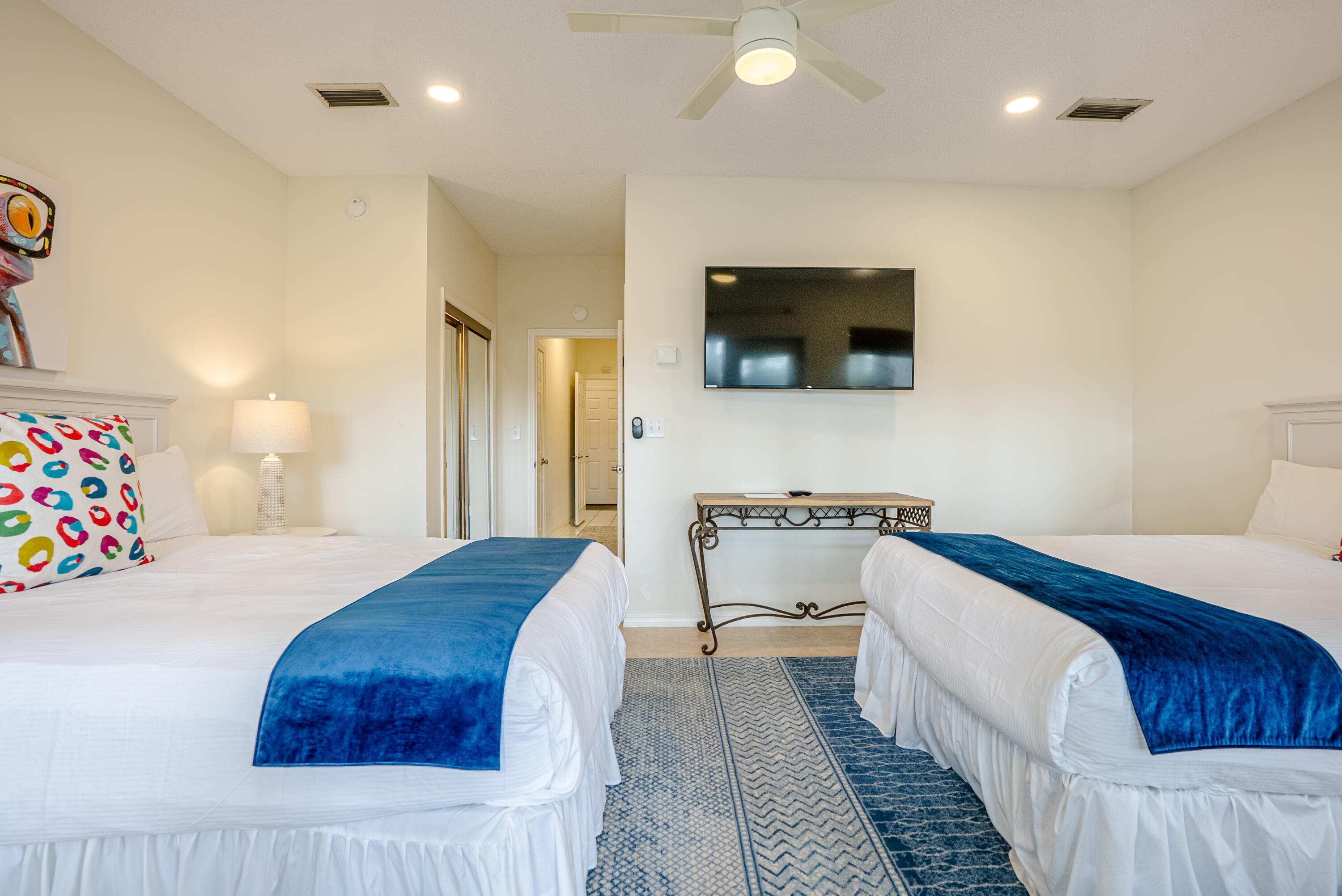 10 Mar-A-Lago Boulevard, Unit 14 Santa Rosa Beach, FL 32459 - Photo 29 of 47 a bedroom with a bed and a flat screen tv