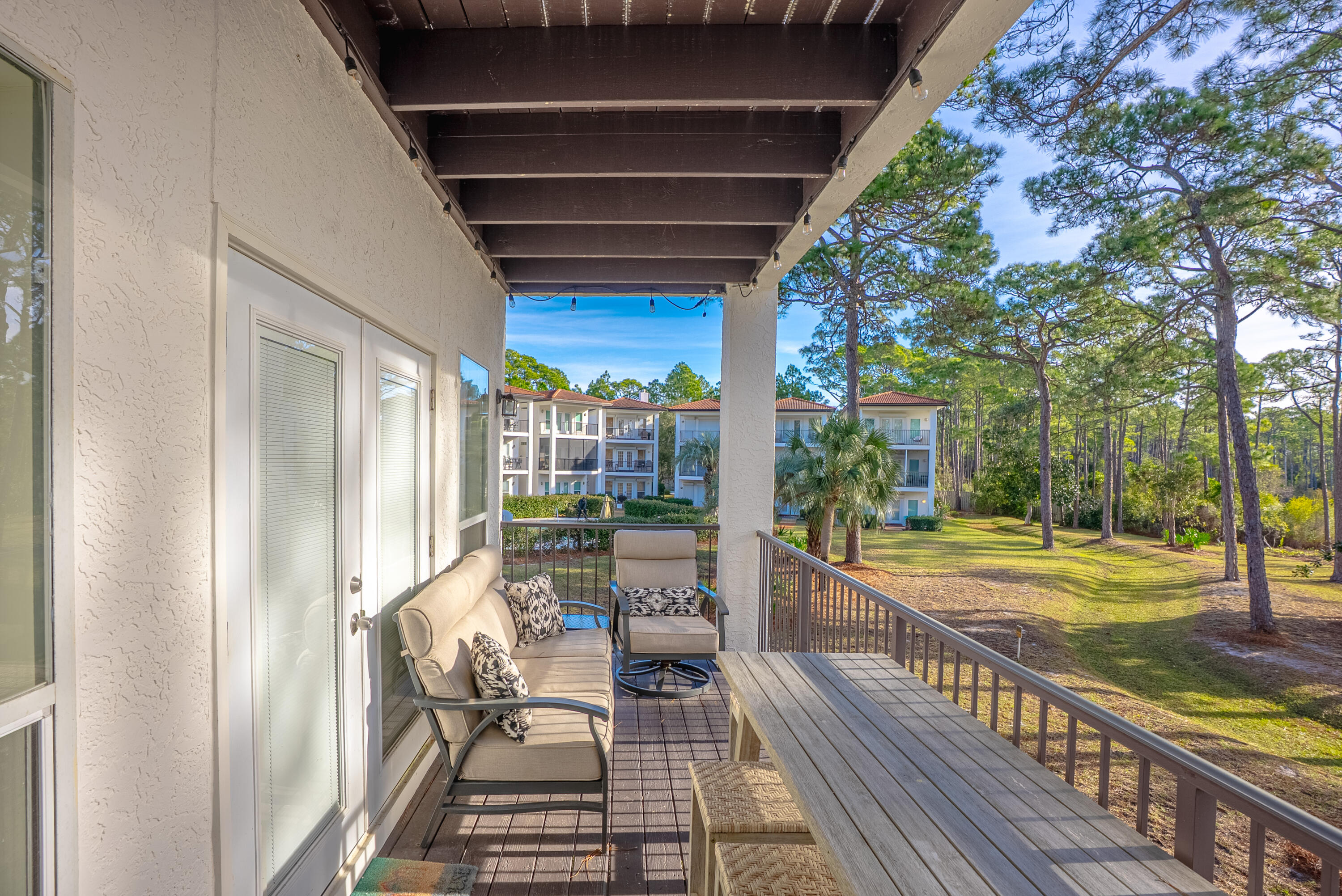 10 Mar-A-Lago Boulevard, Unit 14 Santa Rosa Beach, FL 32459 - Photo 34 of 47 a view of a balcony with chair and wooden floor